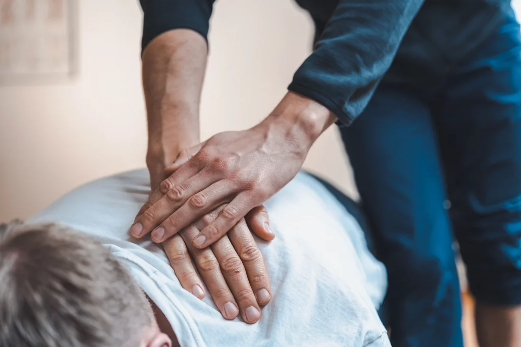 Manual therapy hands-on back treatment at Velocity Physical Therapy